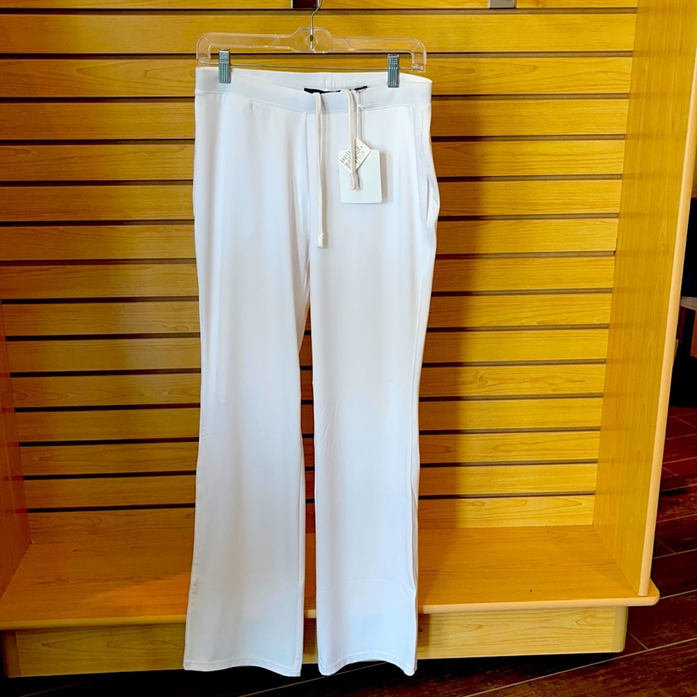 Green grass white tennis pants